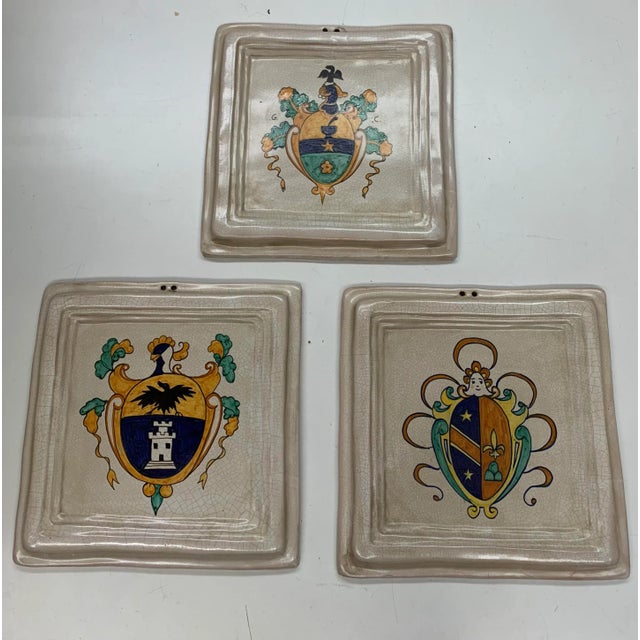 Set of three Italian Tiles with each tile having a unique hand painted insignia.