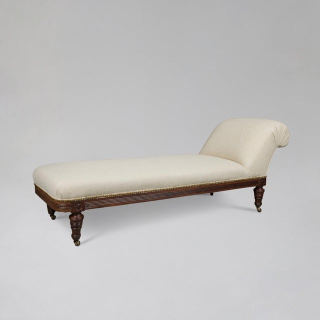 This elegant 1920s chaise lounge embodies timeless sophistication with its graceful, sculptural silhouette and refined...