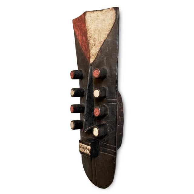 Authentic vintage mask from the Grebo people of Western Africa. Original black, red, and white painted finish.