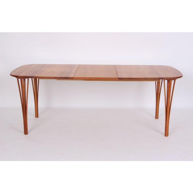 Beautiful, light-colored, oval dining table made of solid cherry wood with cherry wood legs. An additional 48 cm long...