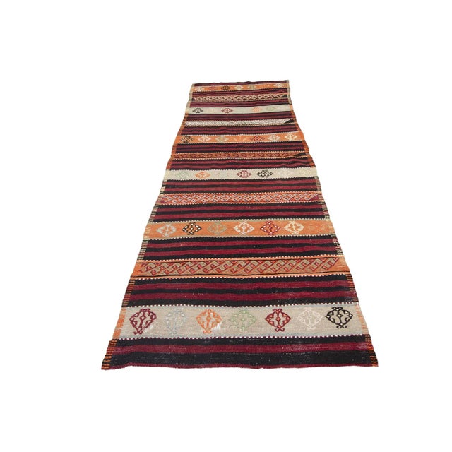 Handwoven vintage kilim runner rug from Denizli region of Turkey. Approximately 45-55 years old. In very good condition.