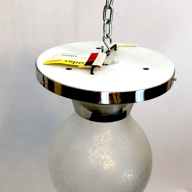 Vintage condition never used for this ceiling lamp produced in Italy by Stilux Milano. Made from polished aluminum and...
