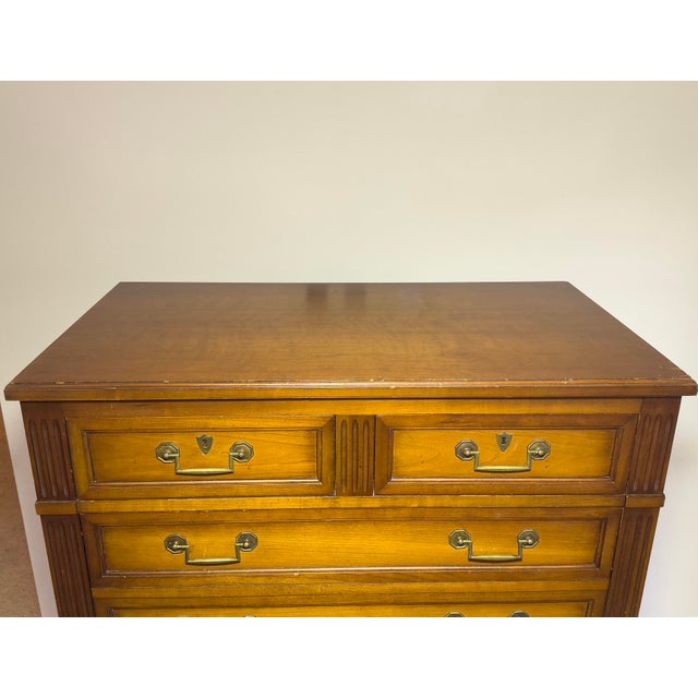A stately Henredon highboy with seven drawers of storage and heirloom presence. Crafted by Henredon, one of America's most...