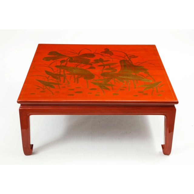 The square top decorated in gold with cranes in a river setting amongst lotus blossoms and other water flora and fauna;...