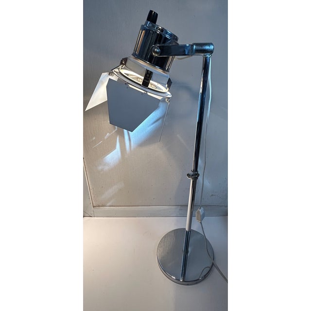 Mid-Century Modern Colortran Studio Film Style Lamp with adjustable height. Having chrome base and pole with white powder...