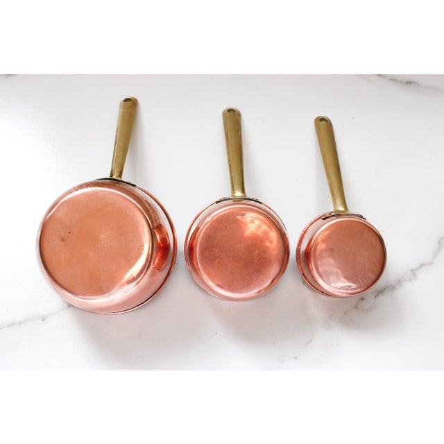 Set of three long handled measuring cups. We love to repurpose theses pretty cups into handy kitchen scoops. Such as...