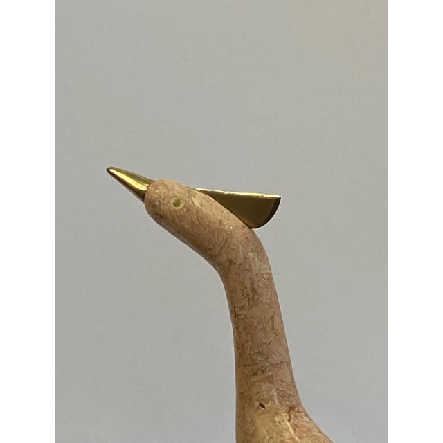 A gorgeous bird sculpture made of tessellated stone and brass designed by Robert Marcius for Casa Bique.