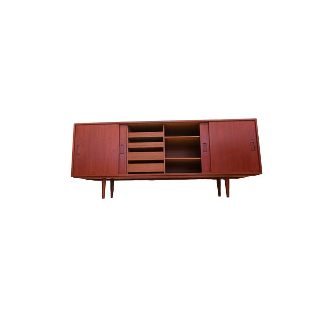 Stylish Danish sideboard in teak with sliding doors. The sideboard has undergone a careful and detailed renovation where...