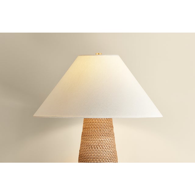 The Forest Heights table lamp reimagines a familiar silhouette with a distinctive materiality. A tightly coiled and lashed...