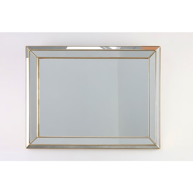 A striking Hollywood Regency mirror by Deknudt, crafted in Belgium around 1980, combining sculptural glamour with the...