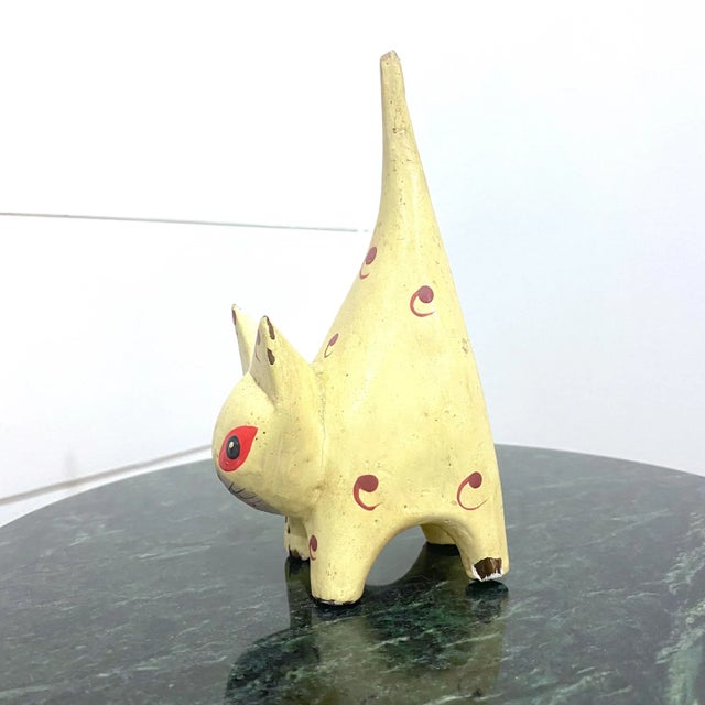 One adorable hand carved and hand painted cat figurine with tail high. Might be used as a ring holder? 1950’s era. Welcome...