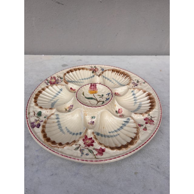 French Majolica oyster plate with flowers circa 1890 signed Longchamp.
