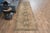 Vintage Hand-Knotted runner rug is a semi-antique vintage area rug. The '70s Eastern region of Anatolia's unique rug is...