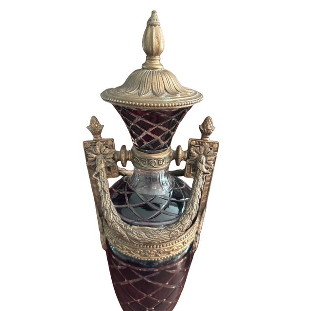 A striking antique ruby cut-to-clear crystal lidded statement piece urn vessel, richly mounted in ornate Second-Empire...