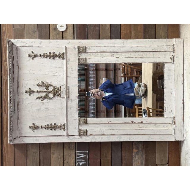 This trumeau has been completely restored. Its decorative elements are made of real wood and ceramic. The patina is...