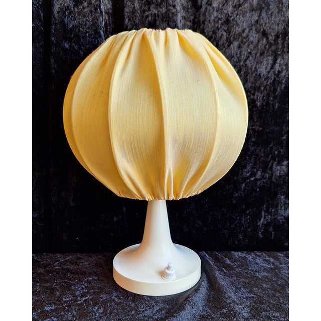 Vintage Table Lamp with White Plastic and Yellow Fabric Shade, 1970s, in Very Good conditions. Designed 1970 to 1979...