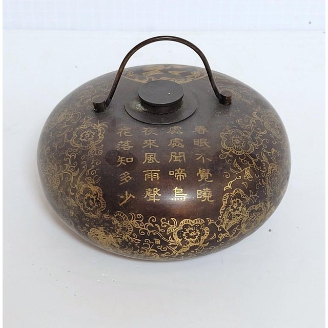 A richly patinated antique Chinese bronze warmer dating to the late Qing Dynasty to early Republic period, circa...