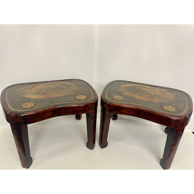 A pair of small hardwood rectangular low tables with a deep apron, sturdy straight legs and hoof feet. The tops are inlaid...