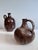 A pair of handcrafted handled vases from the Serocka workshop, executed in their characteristic speckled brown and natural...