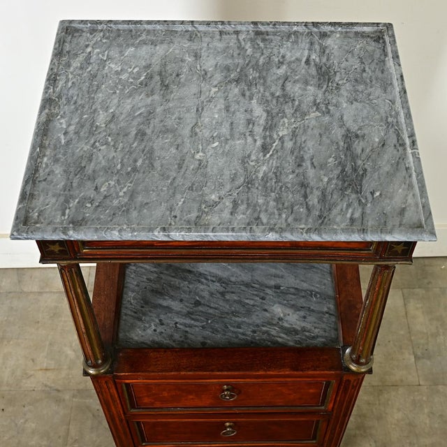 Dimensions: 43” H x 19 ⅞” W x 15 ⅝” D A distinct and stately Neoclassical gentleman’s dressing table from France, perhaps...