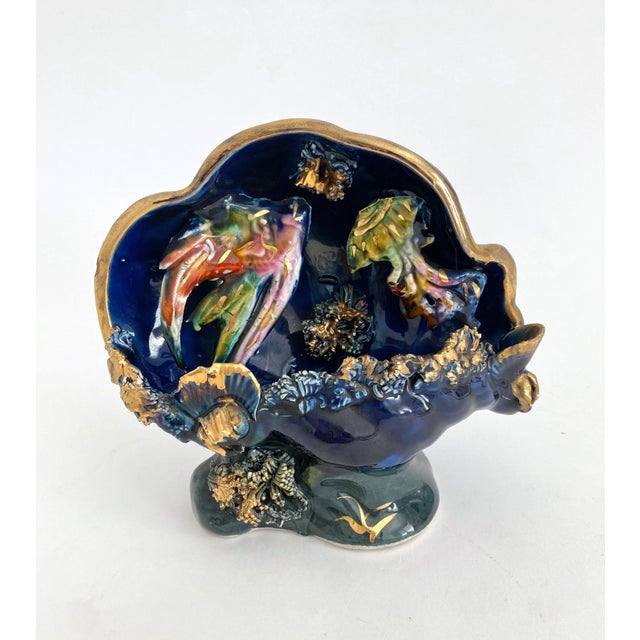 1950s kitsch hand-painted majolica lamp from the Vallauris, France potteries. Fish float in the interior in what...