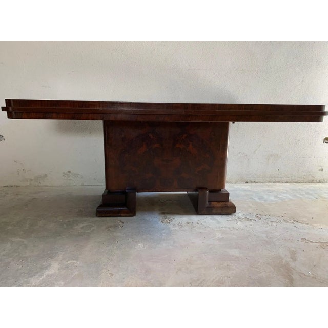 - An Art Deco table - The base comes with two supports that form a U and support the central body in rosewood briar - The...