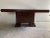 Art Deco table; the base features two continuous shelves forming a 'U' shape in the Cubist style, supporting the central...