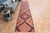 Vintage Hand-Knotted runner rug is a semi-antique vintage area rug. The '70s Eastern region of Anatolia's unique rug is...