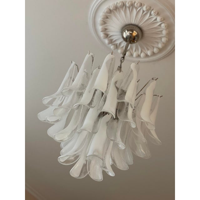Italian Murano Chandelier in the style of Mazzega. The piece is composed of 36 large, hand blown clear glass pendant...