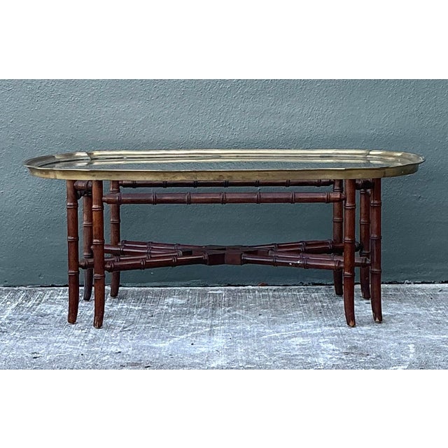 This elegant vintage coffee table is a masterclass in Hollywood Regency design, showcasing a sophisticated fusion of...
