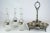 Great for entertaining. A three decanter Edwardian silver plate holder Makes for portable liquor service. Three liquor...