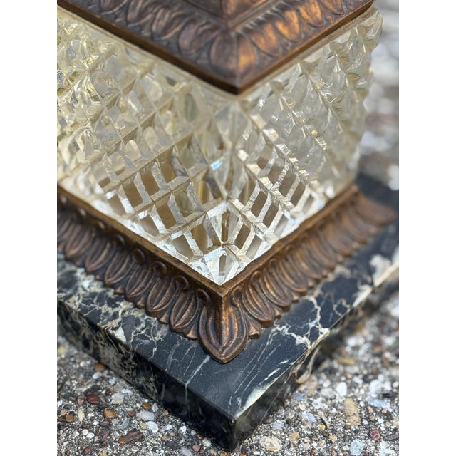 These lamps embody timeless glamour, blending crystal-clear glass columns with warm brass accents for a look that feels...