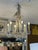 Design Plus Gallery presents the Medium Size Burnished Silver Oslo Chandelier by Chapman & Myers for Visual Comfort. The...