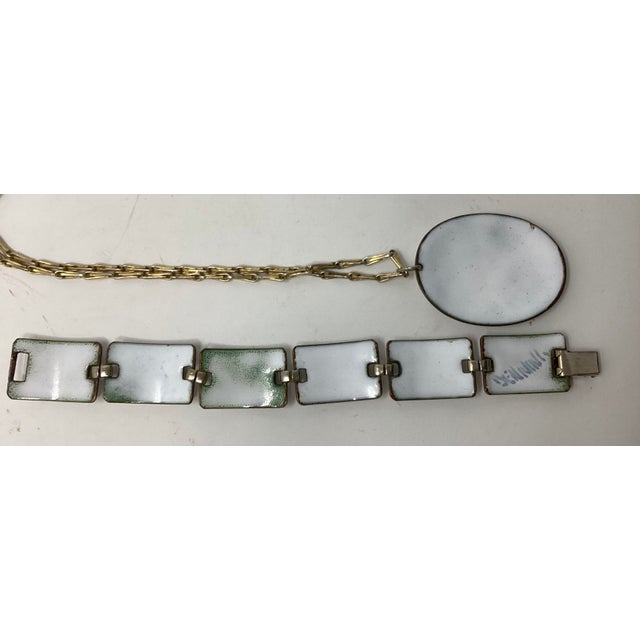 Kay Denning is well known for her enamel art. In 1965 she entered into a contract to produce a series of striking jewelry...