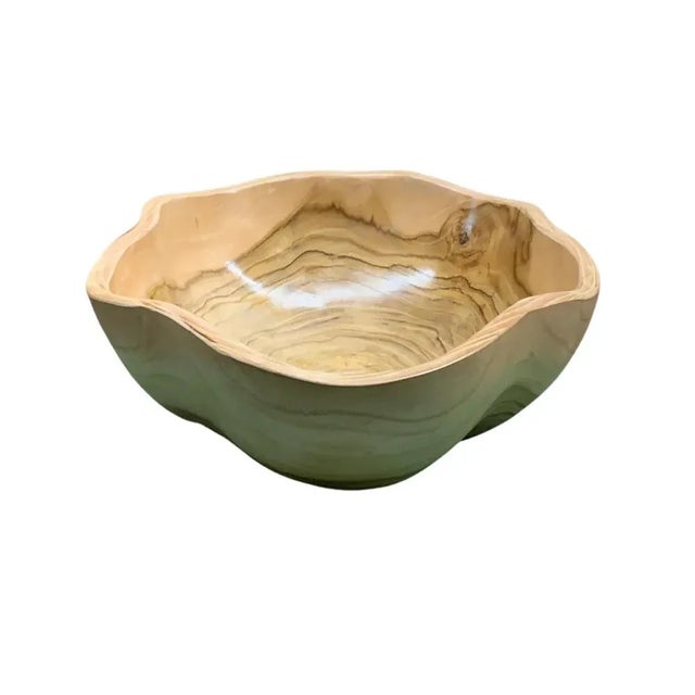 This teak live edge bowl is a unique piece showcasing the natural beauty of teak wood. Crafted by skilled artisans, its...