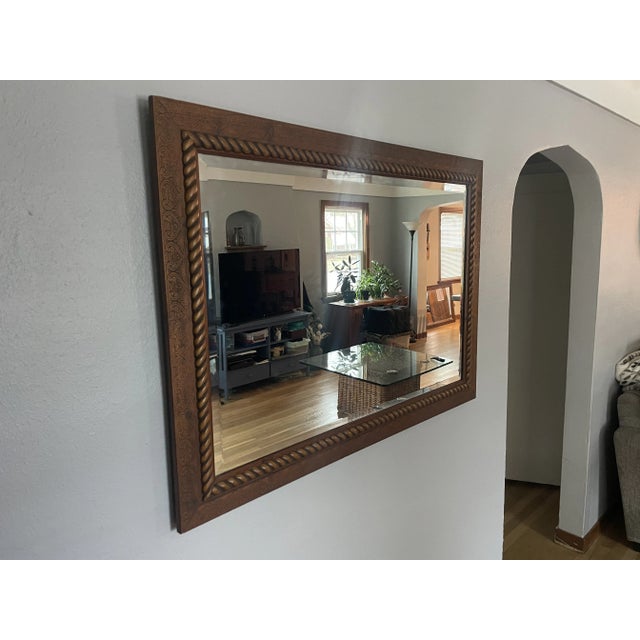 A beautiful set of two vintage Craftsmen matching mirrors, with beveled edges and real wood frames engraved with a lovely...