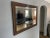 A beautiful set of two vintage Craftsmen matching mirrors, with beveled edges and real wood frames engraved with a lovely...
