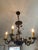 French Provincial Early 20th Century Ornate Leaf Gilt Iron Chandelier For Sale - Image 3 of 10