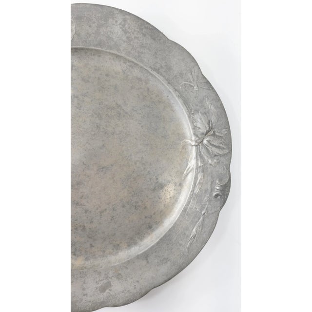 We are selling this large Art Nouveau style pewter charger or platter tray made by Kayserzinn with flower and dragon fly...