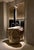 Unique totem sink in jurassic fossil stone by nerinea. Dimensions: w 45 x d 45 x h 90 cm. Materials: natural stone...