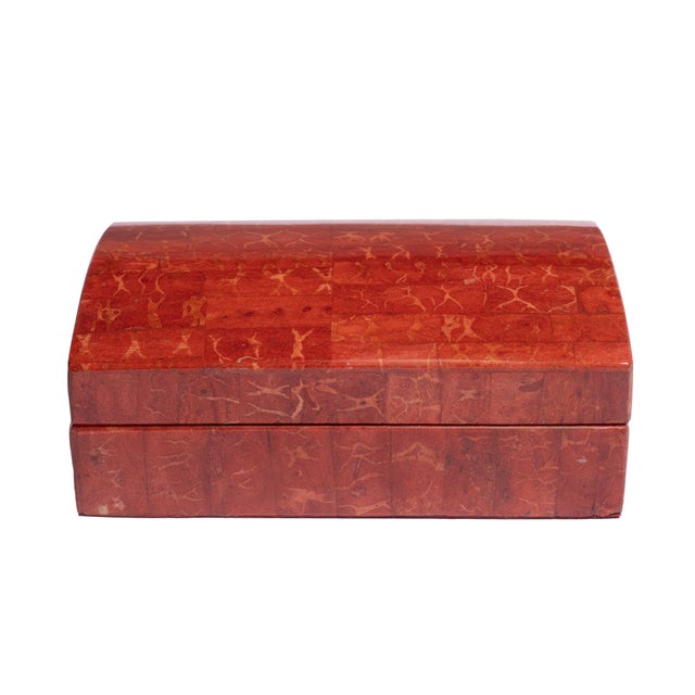 Coral red domed covered box lined in velvet.