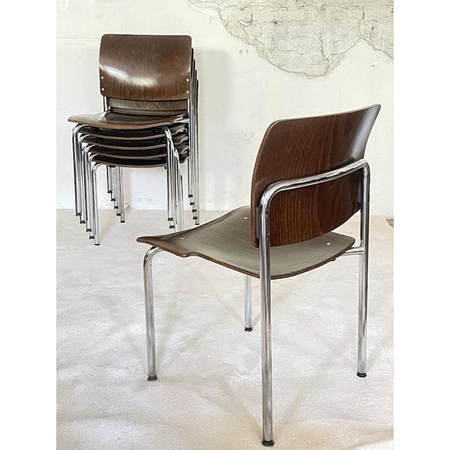 A characterful set of four vintage stacking chairs manufactured by Kusch + Co in Germany during the 1970s. Each chair...