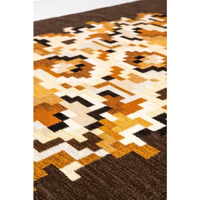 Rare flat-weave rug model Korall brun designed by Erik Lundberg. Produced by Vävaregården in Sweden. This piece is...