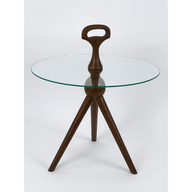 Extremely rare, elegant and highly decorative Mid-Century Modern tripod side table. Designed and manufactured probably in...