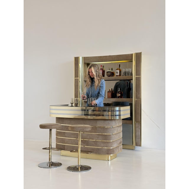 An iconic original bar cabinet from the 1970s, the perfect expression of the luxury and sophisticated design typical of...