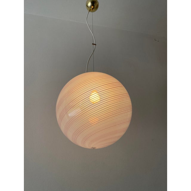 A splendid de majo murano chandelier, made in venice on the island of murano in the 1970s, features a highly refined...