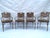 A beautifully detailed set of four arm chairs in the style of McGuire. These are not labelled however the quality of...