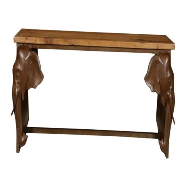 This console table features metal elephant head appliques and is crafted from mango wood, offering a 5-foot long narrow...