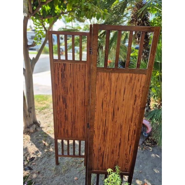This folding privacy partition is a 3-panel "Savannah" style room divider featuring a solid hardwood frame with a rich,...