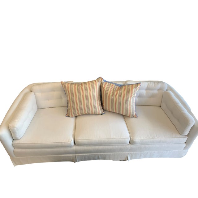 This pillow features a classic, vertically striped pattern in a palette of green, red, and blue with a blue solid backing....